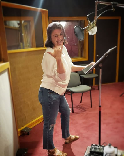 Voice Actor Amy Ulrich in the studio